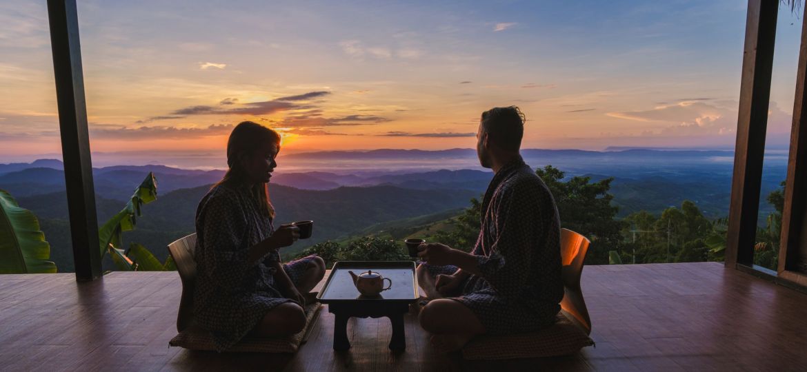 a couple of men and women on vacation in Northern Thailand staying at a homestay cabin hut