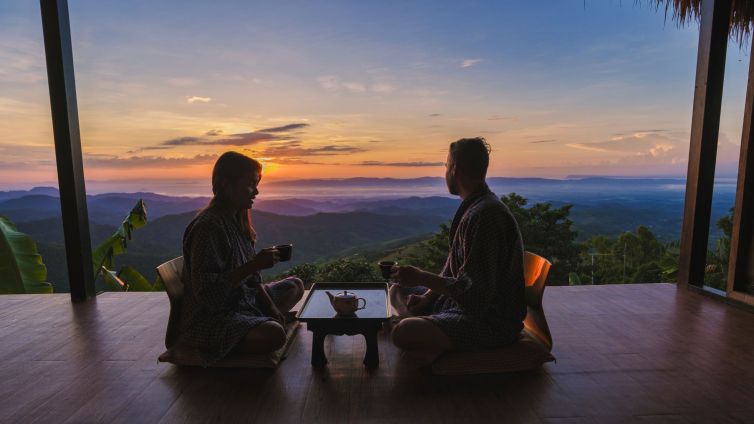 a couple of men and women on vacation in Northern Thailand staying at a homestay cabin hut